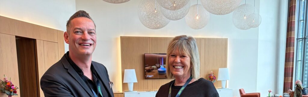 Hendrik Taise of BALLAND Messe-Vertrieb with FIT Show's Nickie West