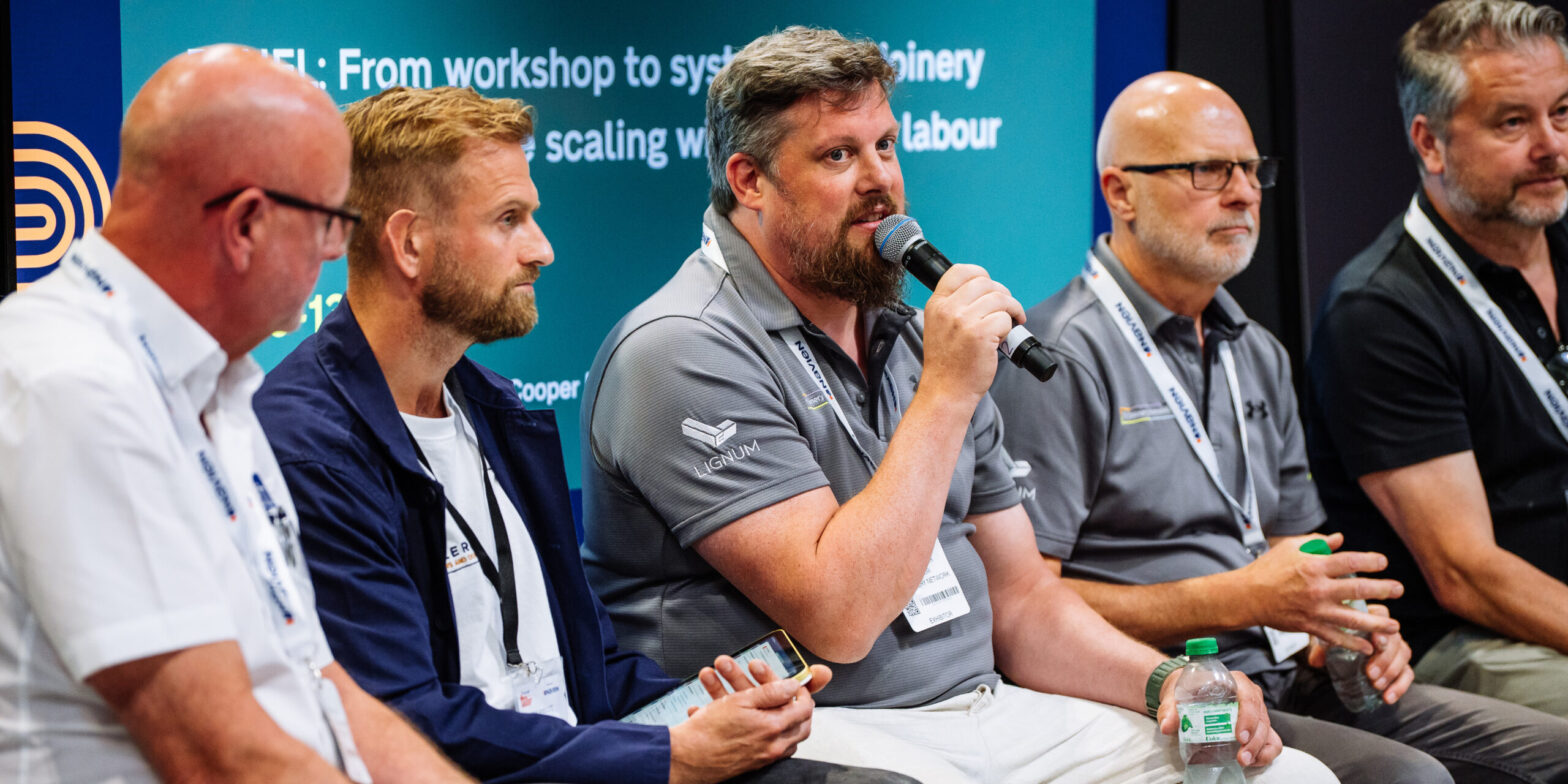 TJN’s Lignum timber windows and doors prove at big draw at PWE The Joinery Network's (TJN) Andy Ball (second from right) and Erin Woodger (middle) during a seminar at Professional Woodworking Expo (PWE) 2026